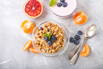 Healthy breakfast - muesli, yogurt and fruit. Selective focus. Copy space. Top view