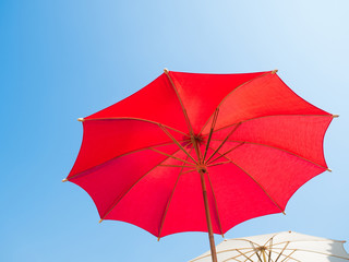 colorful umbrella with full spanned against blue sky
