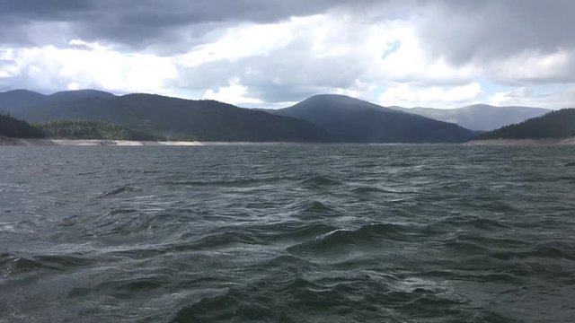 Lake with Rough Waves and Storm Clouds