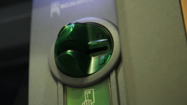 woman hand inserting credit card in atm. banking cash machine