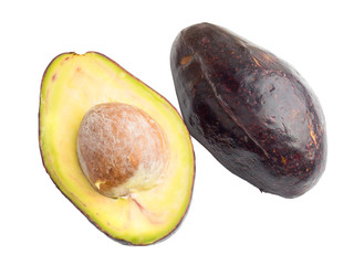 ripe avocado fruit sliced across a half showing portion detail