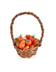 tomatoes in basket isolated on white background