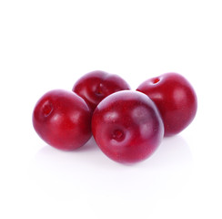Red plum fruit isolated on white background.