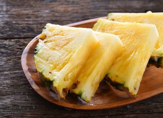 fresh pineapple on wooden table.