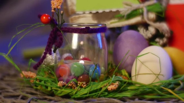 Easter Hen and Quail Eggs and an Orange Photo Frame Are on the Festive Round Table With Easter Gifts in Studio