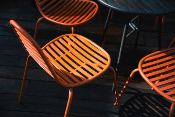 Orange chairs in dark scene