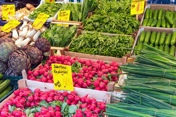Radish, chive and other vegetables for sale at a market