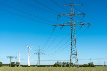 Transmission lines with some wind wheels seen in Germany