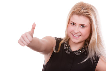 Smiling blonde woman making thumb up gesture