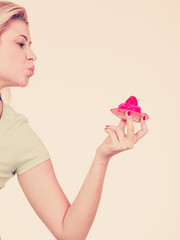 Woman hand holding sweet strawberry cupcake