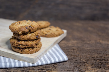 oat and Chocolate chip cookies on rustic wooden table background
