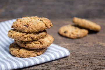oat and Chocolate chip cookies on rustic wooden table background
