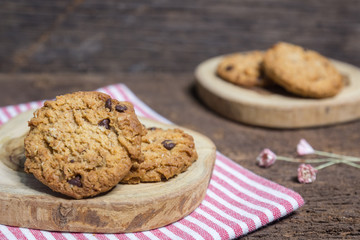 oat and Chocolate chip cookies on rustic wooden table background