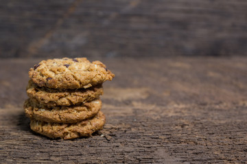 oat and Chocolate chip cookies on rustic wooden table background