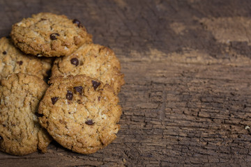 oat and Chocolate chip cookies on rustic wooden table background