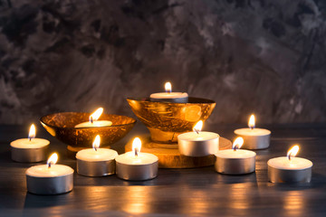 Many burning candles in dark background   in concept spa relaxing , holiday ,merry christmas, REST IN PEACE