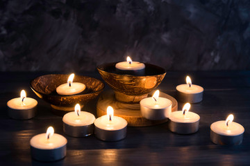 Many burning candles in dark background   in concept spa relaxing , holiday ,merry christmas, REST IN PEACE