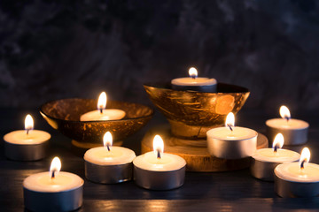 Many burning candles in dark background   in concept spa relaxing , holiday ,merry christmas, REST IN PEACE