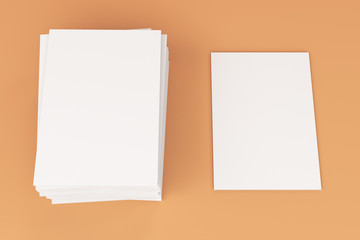 Stack of blank white closed brochure mock-up on orange background