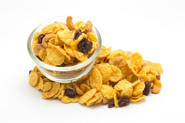 Homemade, a glass bowl of honey caramel cornflakes on white background