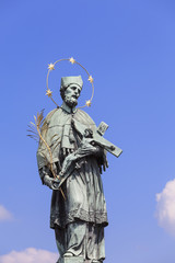 Statue of St John Nepomucene with crucifix in hand, Charles Bridge, Prague, Czech Republic