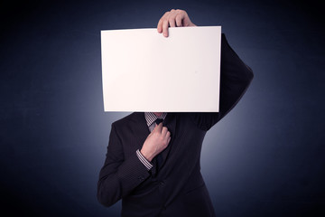 Businessman holding blank paper