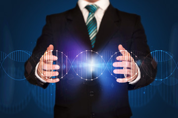 Businessman holding DNA
