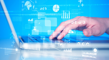 Keyboard buttons pressed by hand with high tech icons