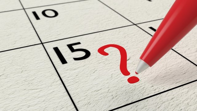 Red Ball Pen Drawing A Question Mark Into A Calendar