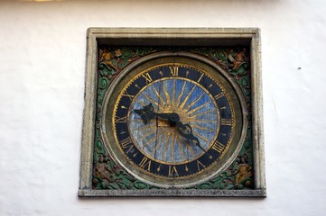 Medieval clock on the wall of church 