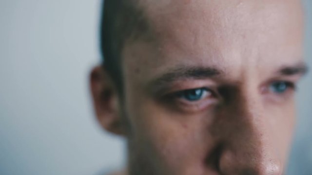 Face of a blue-eyed man close-up
