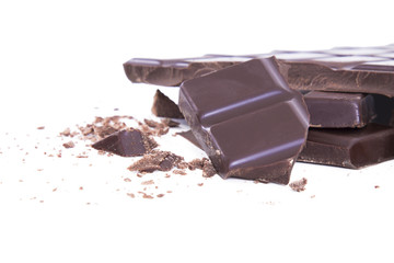 Pieces of chocolate isolated on white