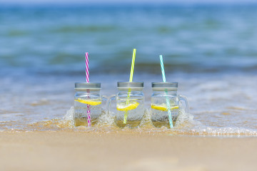 Lukecin, Poland, June 15, 2017: Cold drinks in jar on the beach.