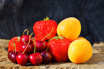 Naklejka na ściany i meble Fresh berries and fruits. strawberry apricot cherry