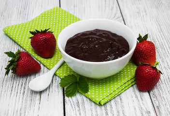 Strawberry jam and fresh strawberries