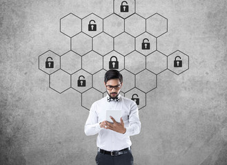 Thoughtful businessman with hexagonal lock security concept