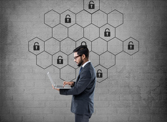 Thoughtful businessman with hexagonal lock security concept