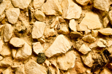 Warm yellow light rocky wall background
