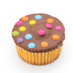 Multiple colorful decorated muffins on a white background.