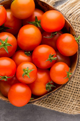 Tomato on the gray background.
