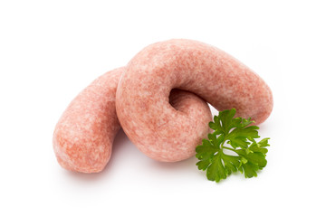Raw sausages with herbs and spices.