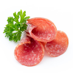 Salami smoked sausages slices isolated on white background.