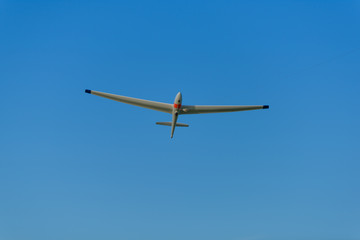 Fototapeta na wymiar Sailplane pulled up in the sky on a line from a skylauncher