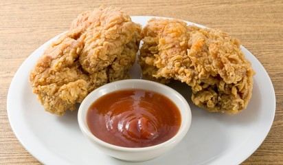 Fried Chicken with Sauce on A White Dish