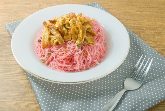 Dish of Red Fried Rice Noodle with Eggs and Scallion