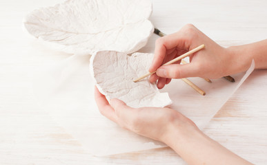 Improving the plaster form of the sheet by hand © ekramar