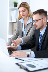 Successful business people working at meeting in office background