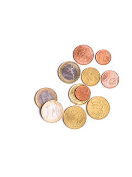 Many Euro coins isolated on white background