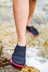 Woman in water shoe