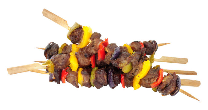 Barbecued beef and sweet pepper kebabs isolated on a white background